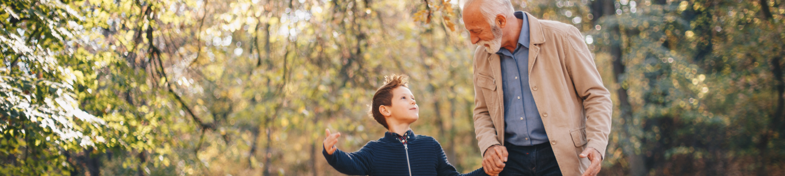 grandfather and granson walking outside